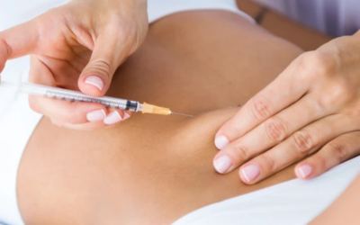 Healthcare professional administers an injection into a patient’s upper arm; a syringe with a needle is visible.